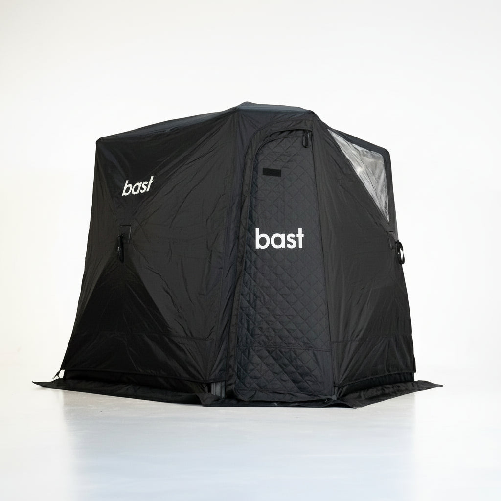 Black tent weather cover with 'bast' branding on a white background