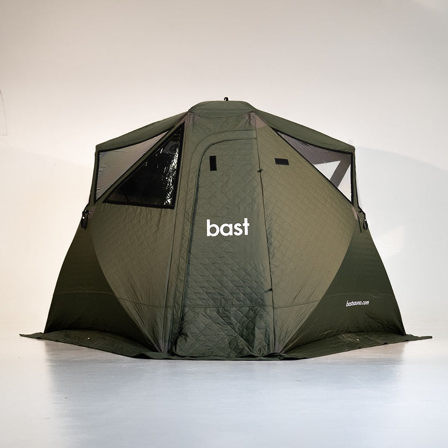 Green sauna tent with 'bast' branding on a white background