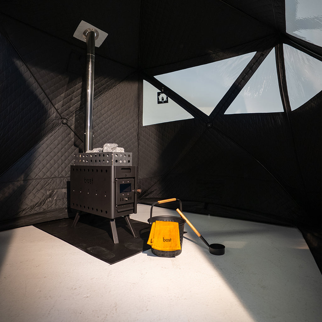 black pop up sauna tent chamber with transparent window panels and sauna stove with equipment