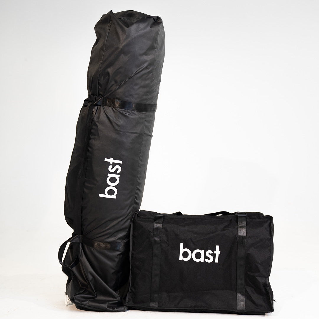 Black sauna equipment bags with 'bast' branding on a white background