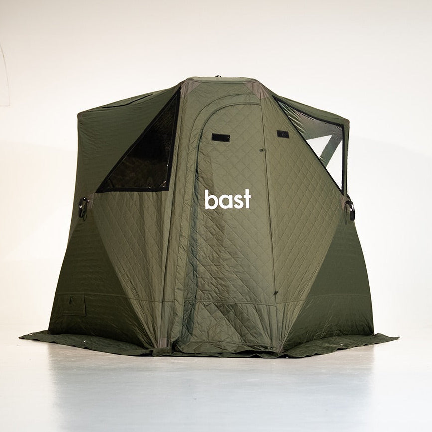 Green sauna tent with 'bast' branding on a white background