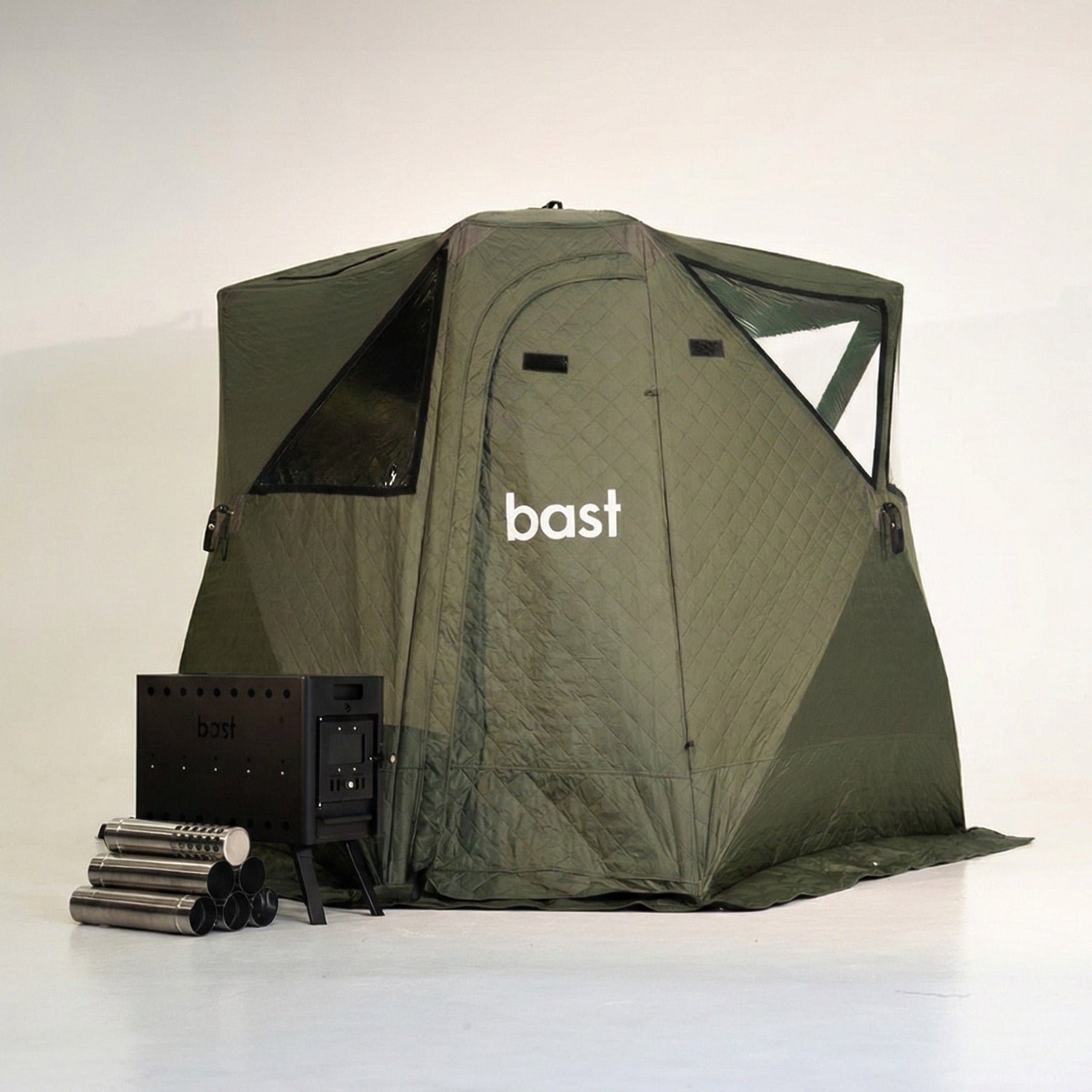 green pop-up sauna tent stove and wooden bench with 'bast' branding on a white background