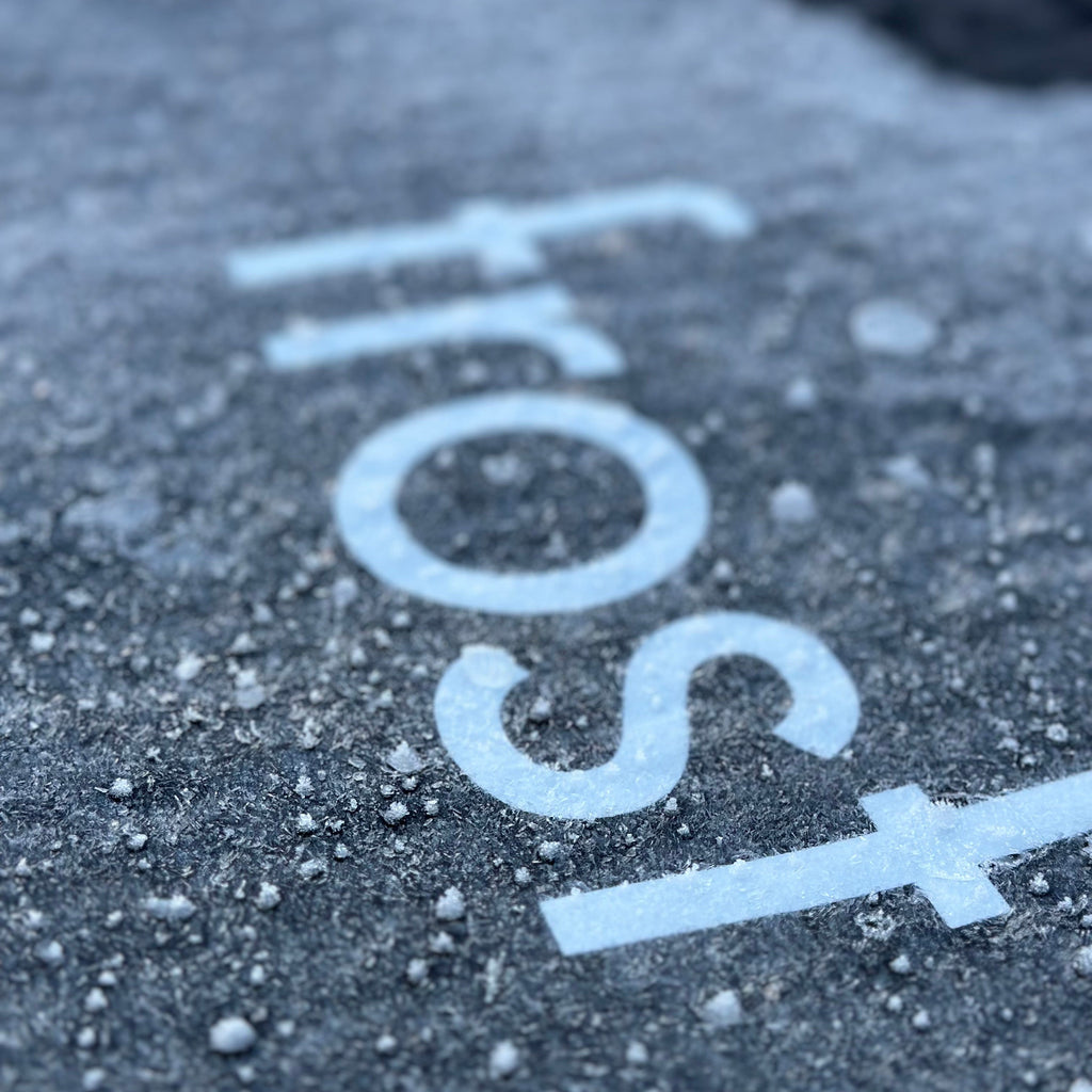 Close-up of frost on a surface with the word 'frost' written above it.